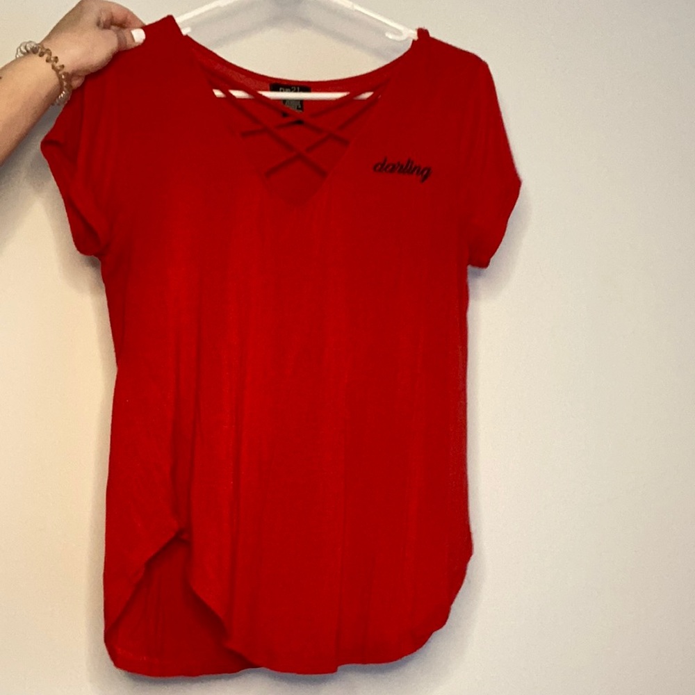 Red v-cut shirt that says “Darling”